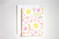 Greeting card with beach-themed illustrations with seashells, sun, and umbrellas