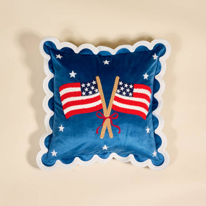 Decorative pillow with American flags and a bow with scalloped edges