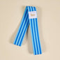 Blue striped stay put towel band for beach chairs