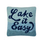 Blue pillow with 'Lake it Easy' text in hooked wool