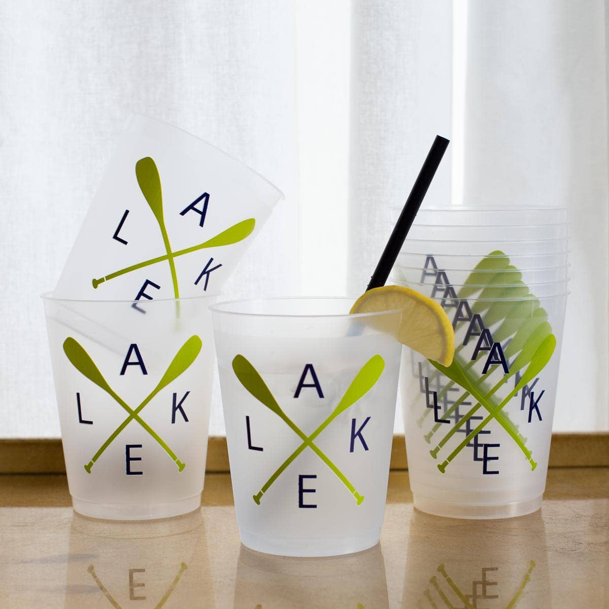 Clear plastic party cups with 'Lake' design and lemon slices for parties, lake house, celebratios, lake season.